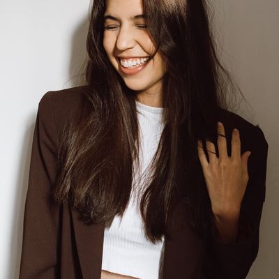 Portrait of Olga Zarichna, a smiling woman with a warm and inviting expression.